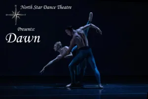Dancers in blue costumes perform a pose on a dark stage as the title 'North Star Dance Theatre Presents: Dawn' appears on the left.